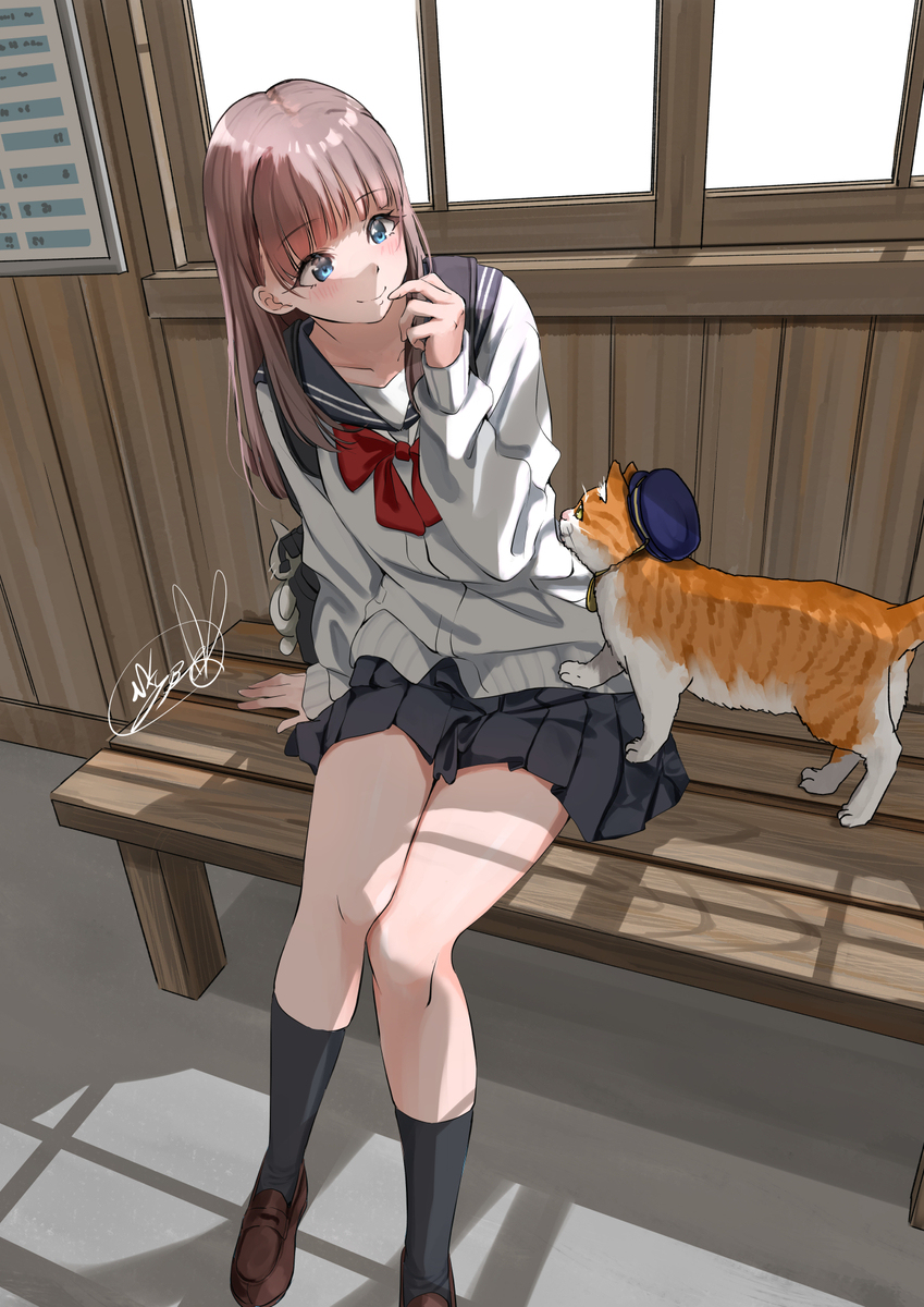 猫の駅長と女の子